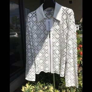 Beautiful white lazer cut leather and tulle. 24 in long with zipper on sleeves.